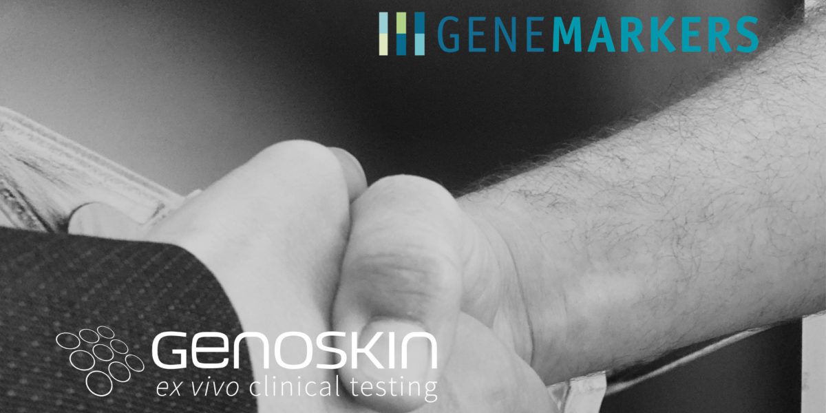 Two people shakings hands illustrating Genemarkers and Genoskin partnership